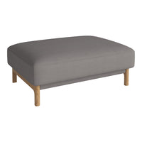 Gray upholstered ottoman with a smooth surface and natural wood legs, perfect for modern decor.