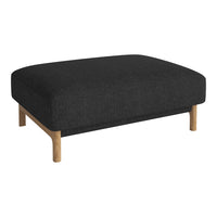 Black upholstered ottoman with a smooth texture and light wooden legs. Modern minimalist design.