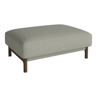 Light gray upholstered ottoman with a simple design and wooden legs, perfect for any modern living space.