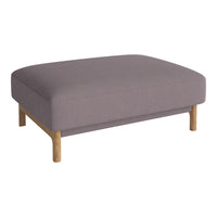 Gray upholstered ottoman with rounded edges and natural wood legs, perfect for modern decor.