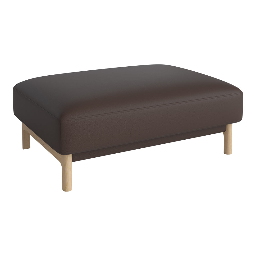 Brown leather ottoman with a smooth finish and light wood legs, featuring a minimalist design.
