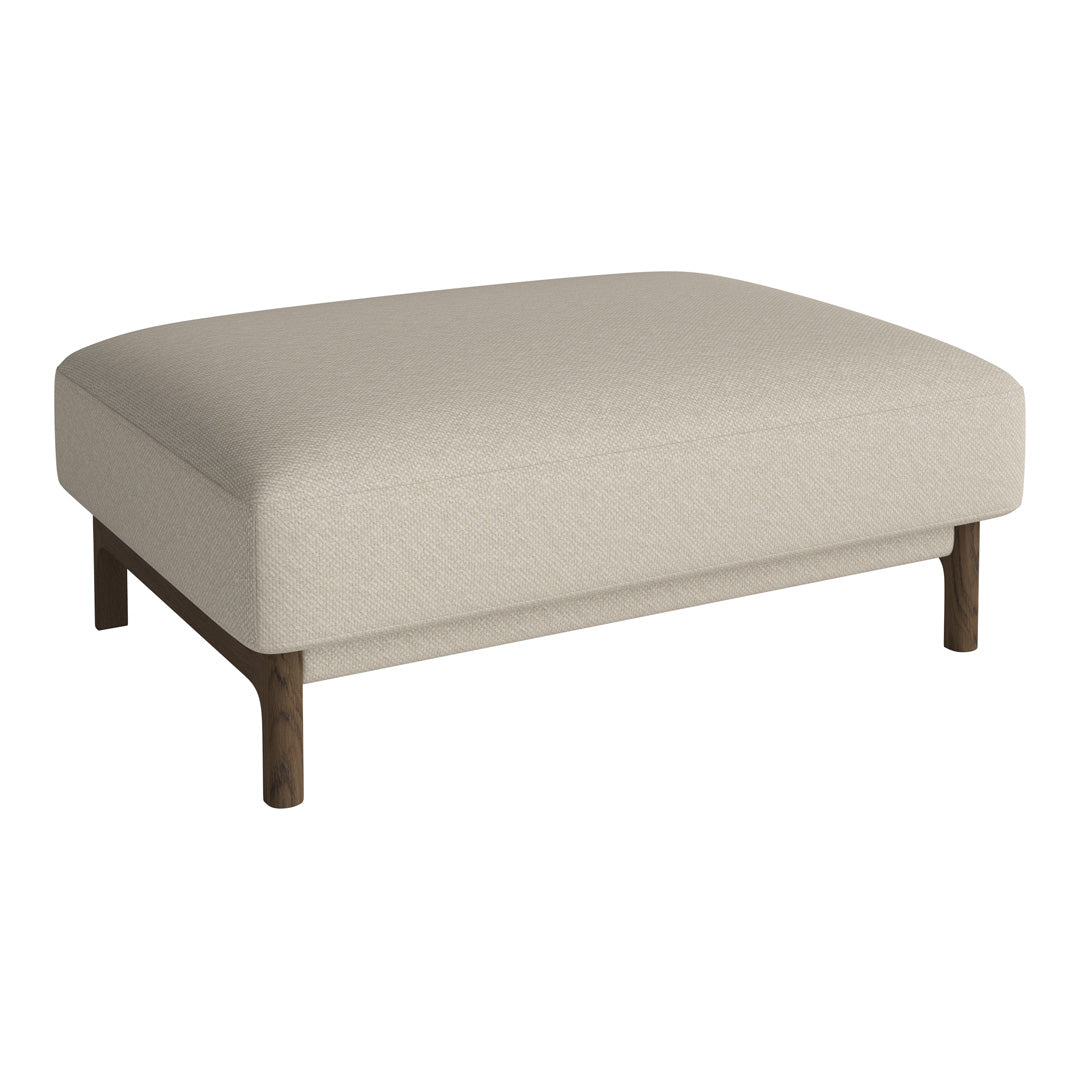 Beige upholstered ottoman with a smooth finish and wooden legs, perfect for modern decor. No patterns.