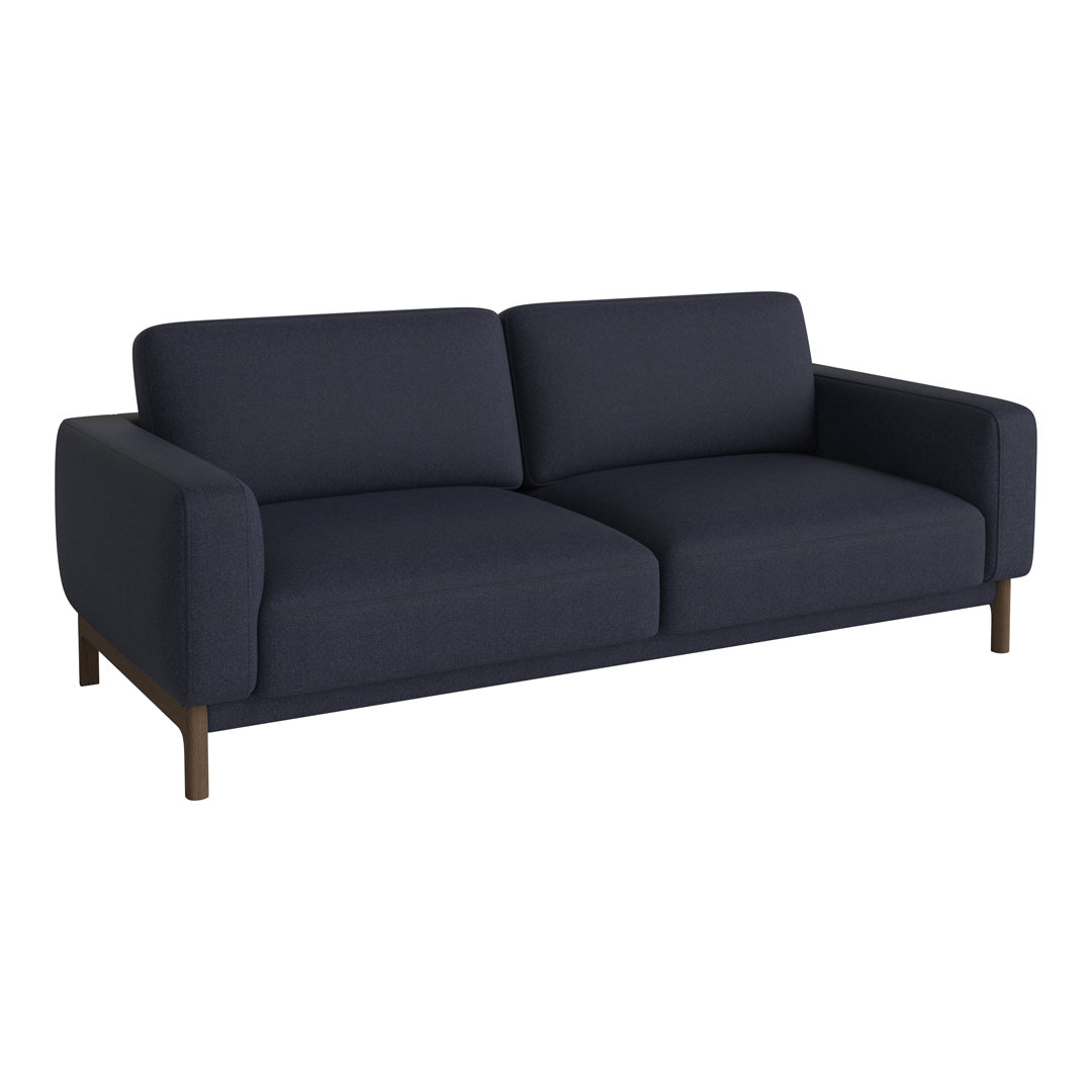 Navy blue sofa with a modern design, featuring a solid color and clean lines, complemented by wooden legs.