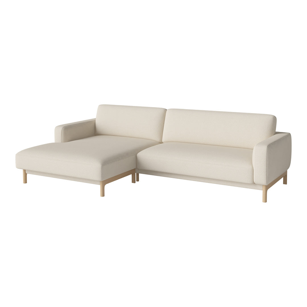 Light beige sectional sofa with minimalist design and smooth, clean lines. Perfect for modern living spaces.