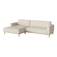 Light beige sectional sofa with minimalist design and smooth, clean lines. Perfect for modern living spaces.