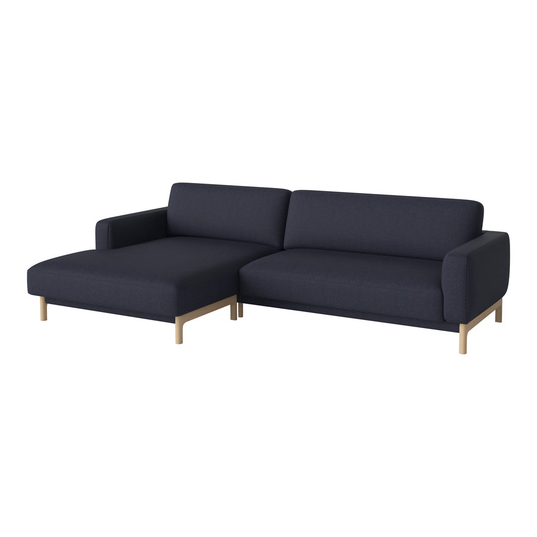 Dark navy blue sectional sofa with a minimalist design and light wooden legs, perfect for modern living spaces.