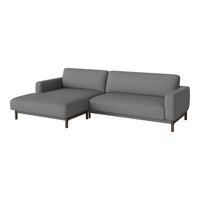 Grey fabric sectional sofa with a smooth texture and minimalist design, featuring dark wood legs. Perfect for modern decor.