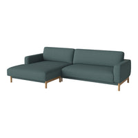 Teal sectional sofa with solid wood legs, featuring a sleek, minimalist design and soft fabric upholstery.