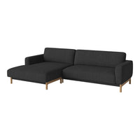 Modern dark gray sectional sofa with clean lines and a textured fabric, complemented by light wooden legs.