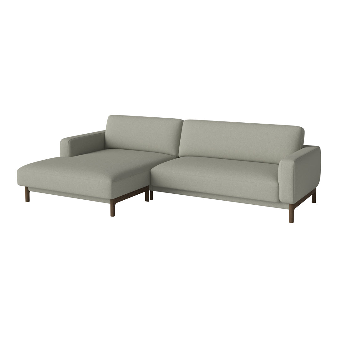 Light gray sectional sofa with smooth, minimalist design and dark wooden legs. Ideal for modern living spaces.