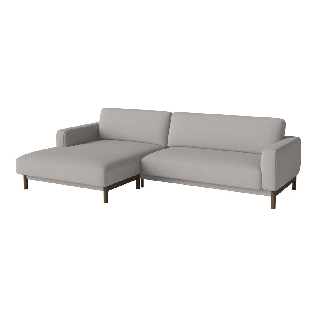 Light gray sectional sofa with a modern design, featuring smooth upholstery and minimalist wooden legs.