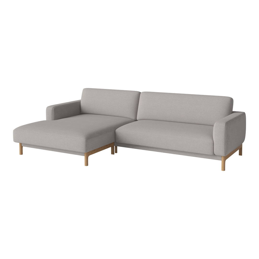 Light gray sectional sofa with smooth fabric, featuring clean lines and natural wood legs. Perfect for modern decor.