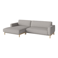 Light gray fabric sectional sofa with a smooth texture and natural wood legs, perfect for modern living spaces.