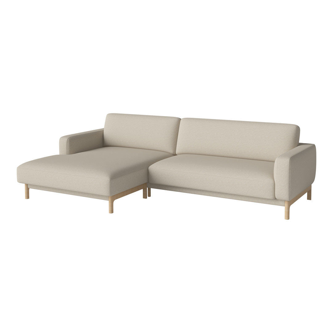 Beige sectional sofa with a smooth fabric finish and light wood legs, perfect for contemporary interiors.