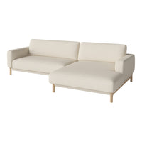 Beige sectional sofa with a minimalist design and light wood legs for a modern, neutral home aesthetic.