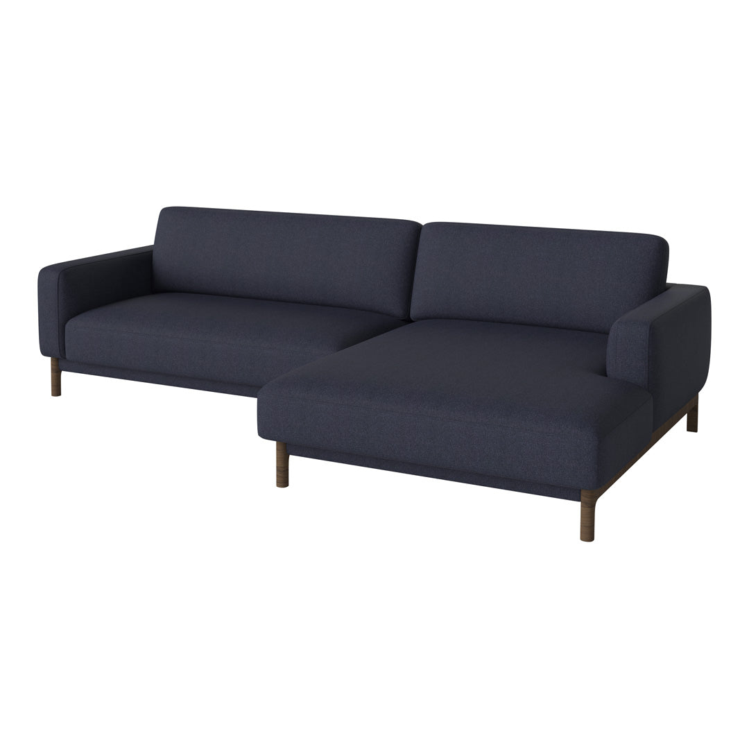 Navy blue fabric sectional sofa with clean lines and subtle texture, featuring dark wooden legs for a modern look.