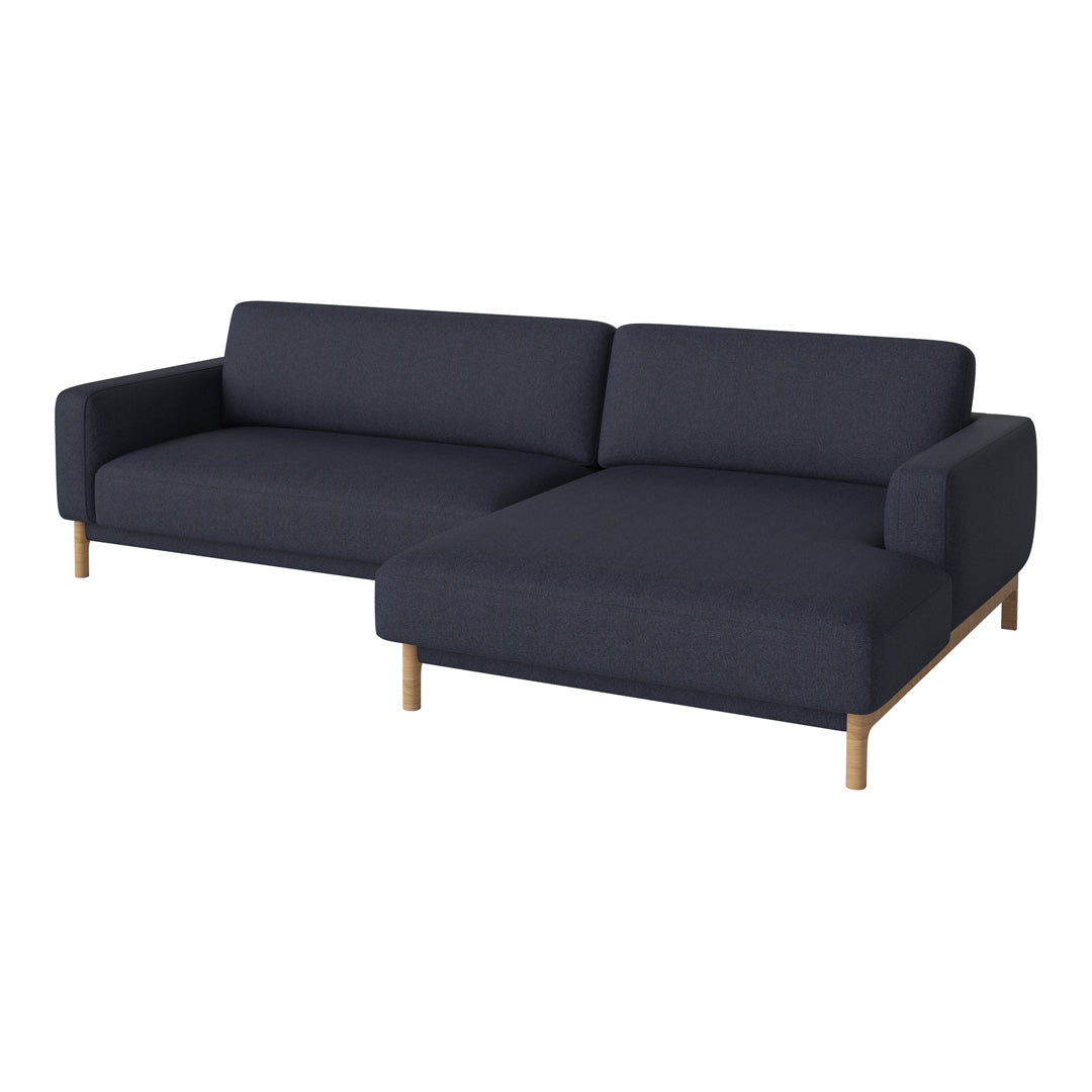 Navy blue fabric sectional sofa with clean lines and light wooden legs, perfect for modern living spaces.