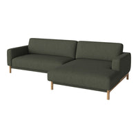 Dark green fabric sofa with clean lines and wooden legs, featuring a modern, minimalistic design.