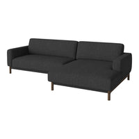 Modern charcoal gray sectional sofa with a clean, minimalist design and wooden legs. Perfect for contemporary decor.