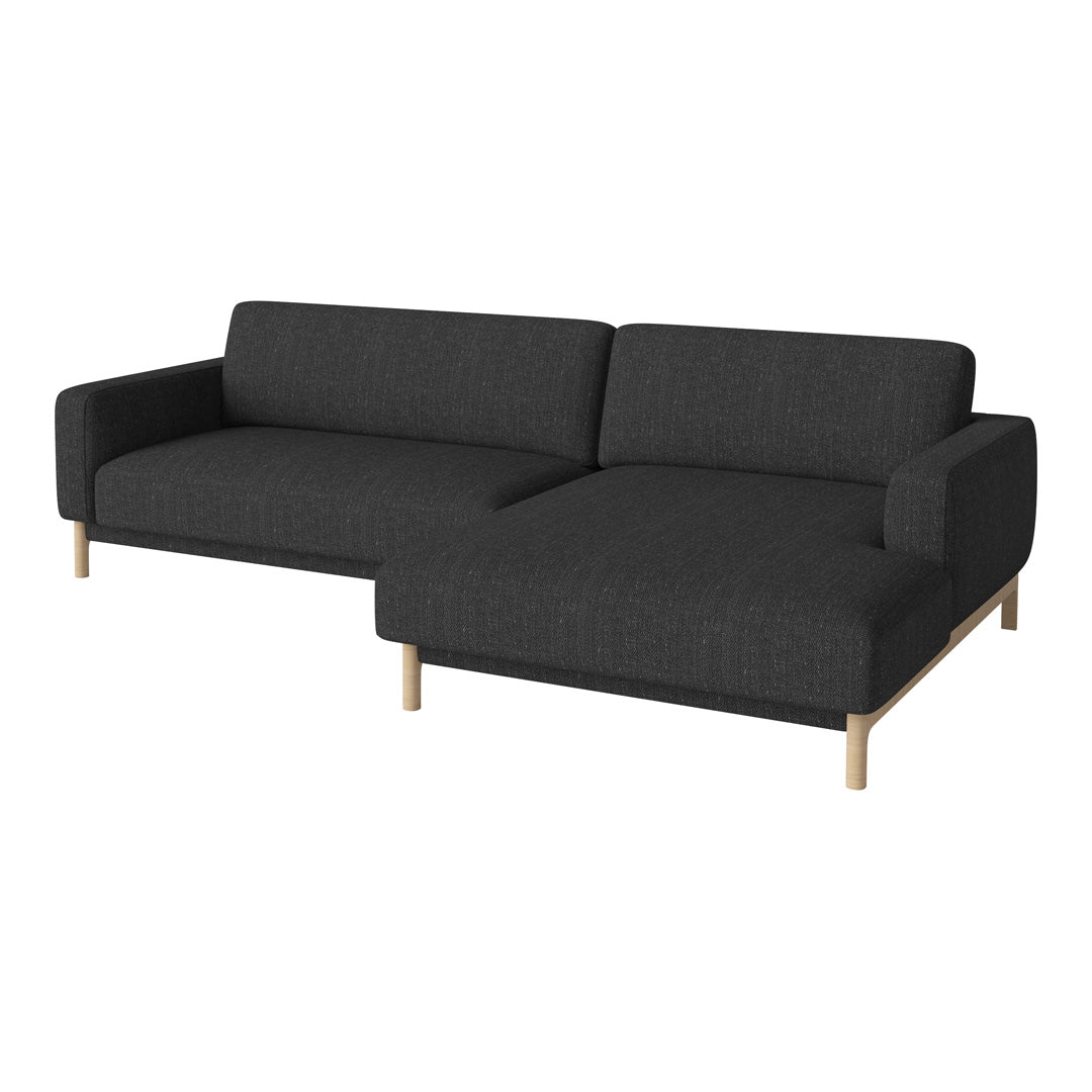 Modern black fabric sectional sofa with a minimalist design and light wood legs. Perfect for contemporary living spaces.