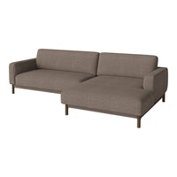 Stylish brown sectional sofa with a simple, solid fabric pattern and minimalist wooden legs. Perfect for modern decor.