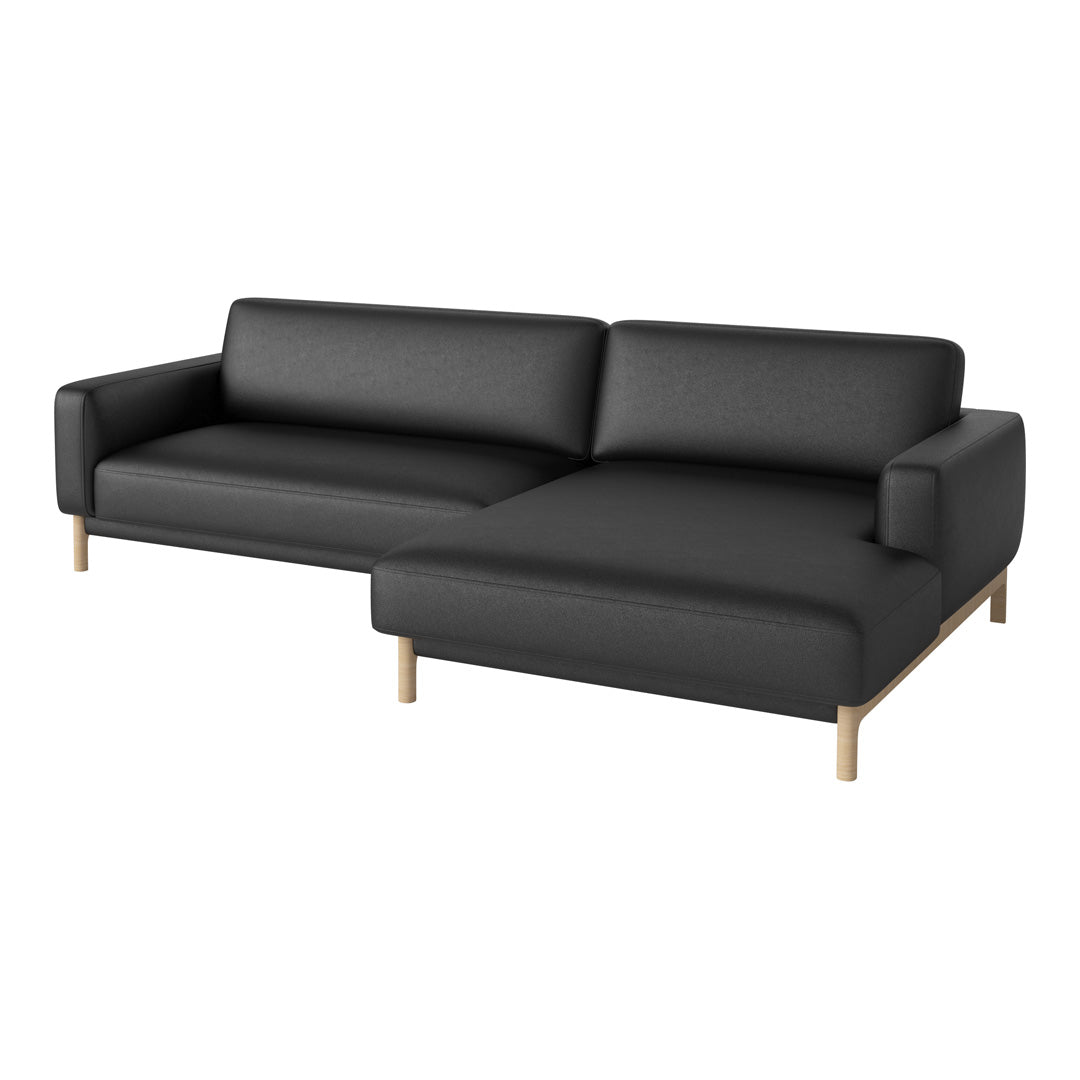 Contemporary black couch with sleek lines and wooden legs, perfect for modern living spaces.