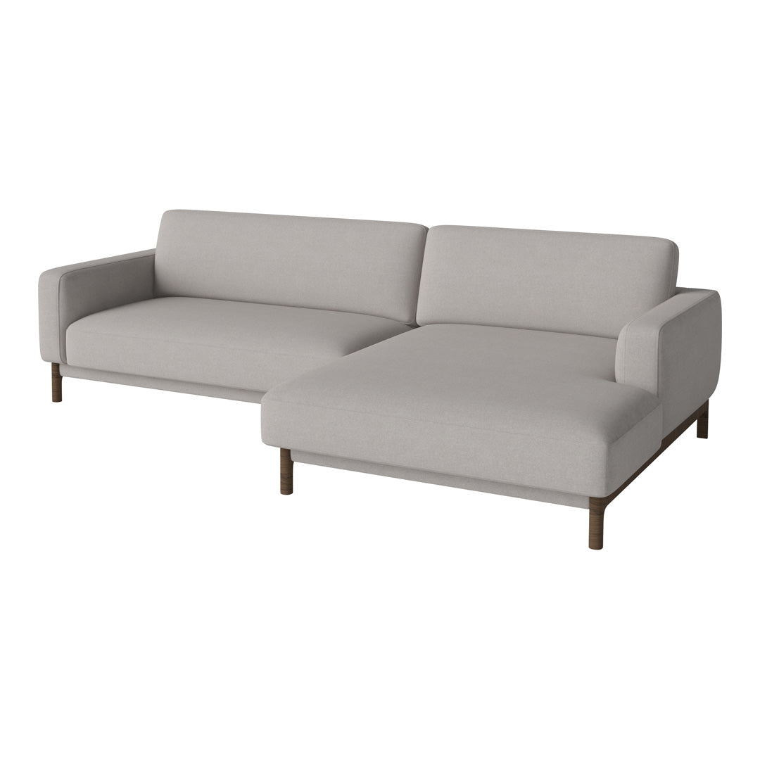 Stylish gray sectional sofa with a minimalist design and clean lines, perfect for modern aesthetics.