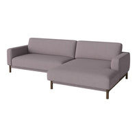 "Light purple sectional sofa with clean lines and no visible patterns, featuring wooden legs for a modern look."