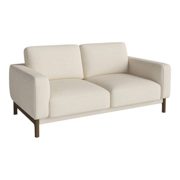 Cream-colored sofa with a modern design and clean lines, featuring a smooth fabric and wooden legs.
