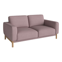 Dusty pink fabric sofa with clean lines and light wooden legs. Modern design for stylish living spaces.