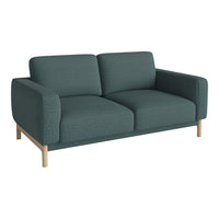 Teal fabric sofa with a textured pattern and light wooden legs, ideal for modern living spaces.