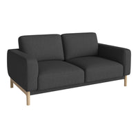Modern dark gray sofa with clean lines and minimalist design, featuring smooth fabric and natural wood legs.