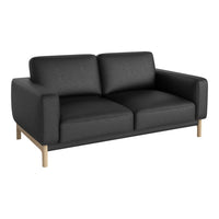 Black upholstered sofa with a minimalist design and light wooden legs. Simple and modern aesthetic for any living space.