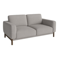 Light gray fabric sofa with clean lines and a minimalist design, complemented by a wooden base.