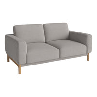 Contemporary gray sofa with clean lines and minimalist design, featuring a light wooden frame and soft upholstery.