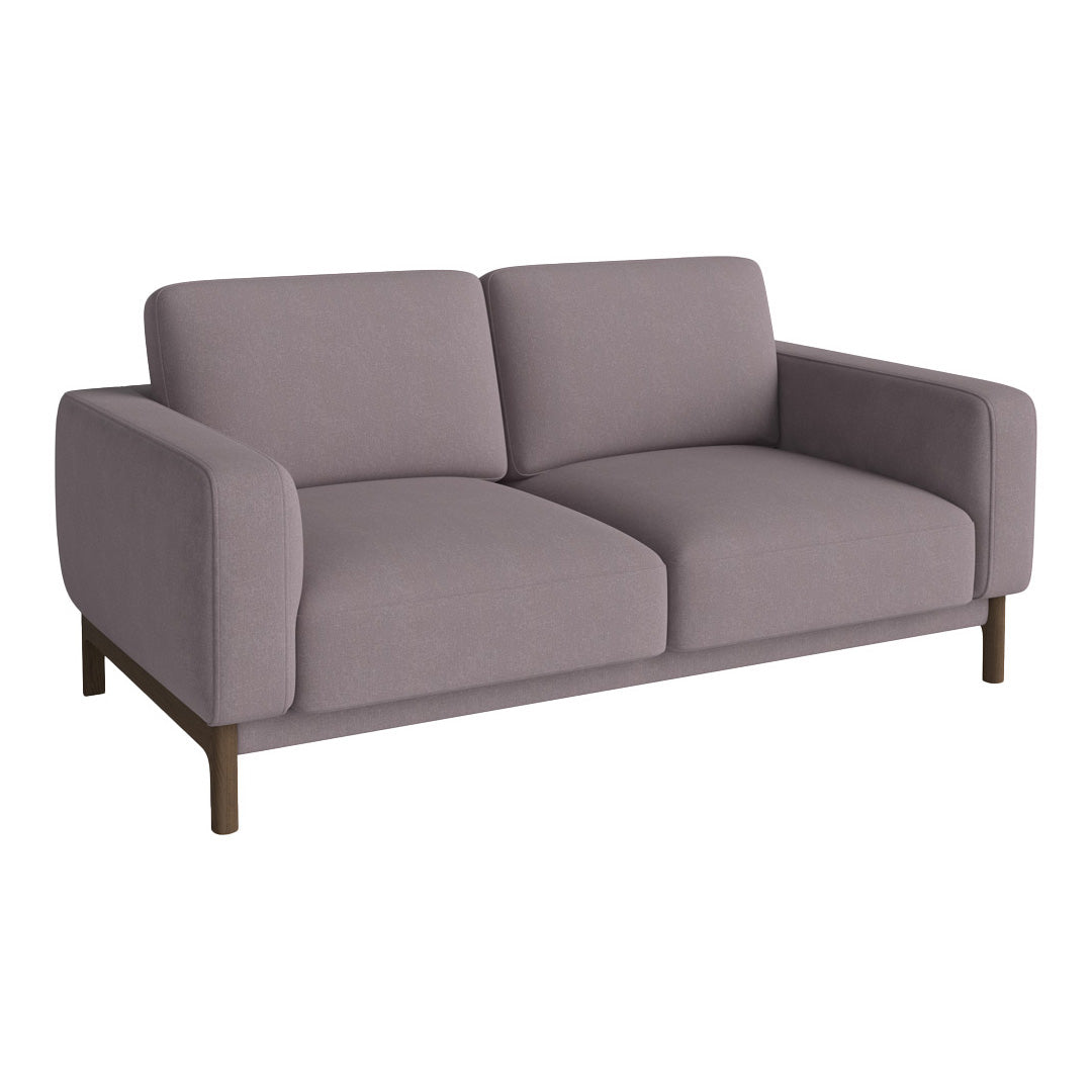 Modern two-seater sofa in soft lavender fabric with smooth, minimalist design and dark wooden legs.