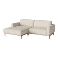 Beige sectional sofa with smooth upholstery and light wood legs, offering a modern, minimalist design.