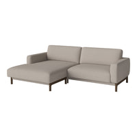 Beige sectional sofa with a smooth fabric finish and sleek wooden legs, perfect for modern living spaces.
