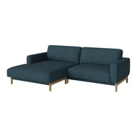 Teal upholstered sectional sofa with a minimalist design and light wood legs, featuring clean lines and a cozy look.