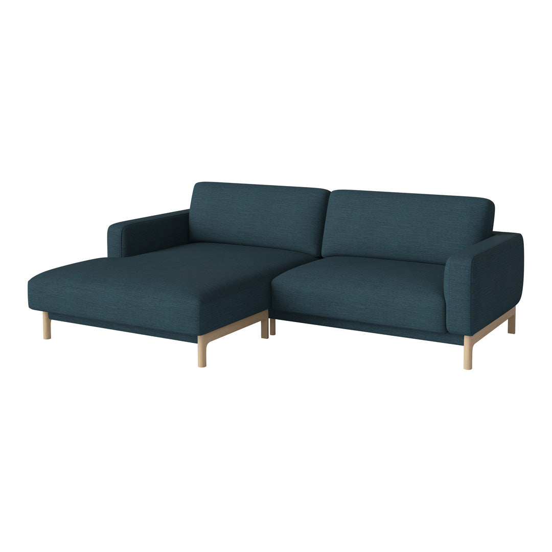 Dark teal sectional sofa with a minimalist design and light wooden legs. Stylish and versatile for modern spaces.
