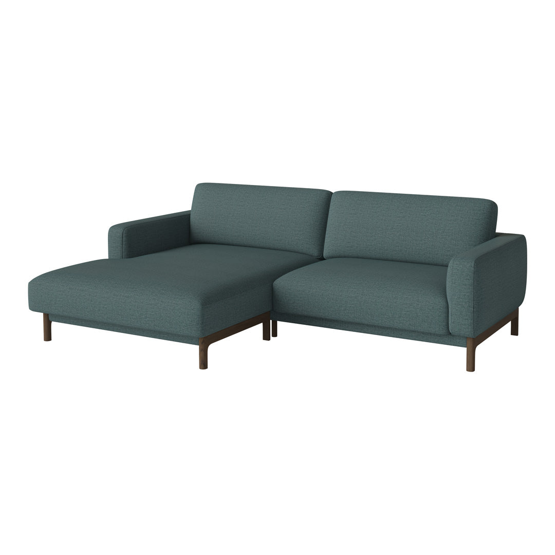 Teal upholstered sectional sofa with a modern design and wood legs, perfect for contemporary living spaces.