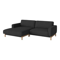 Modern dark gray sectional sofa with clean lines and wooden legs, featuring a textured fabric pattern.