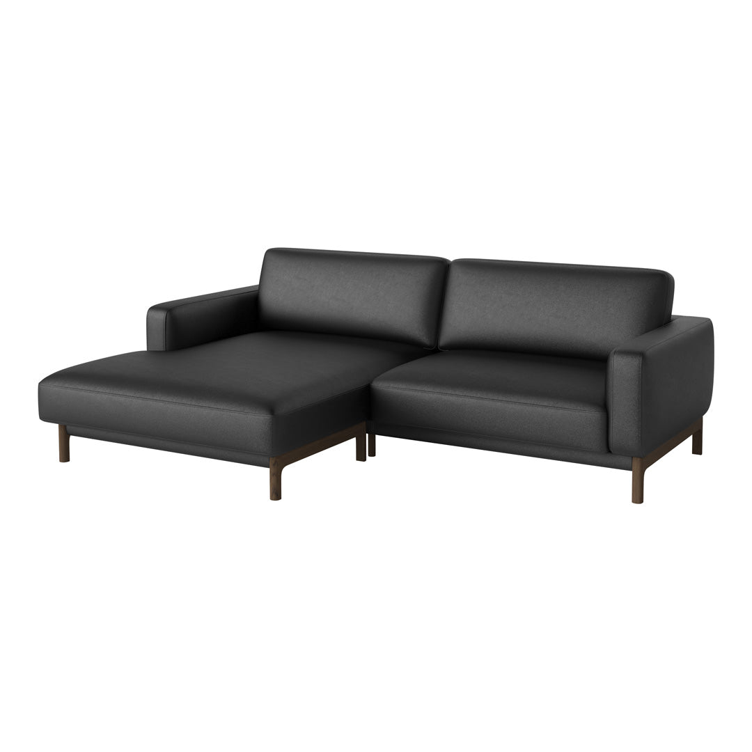 Sleek black leather sectional sofa with minimalistic design and wooden legs for a modern touch.
