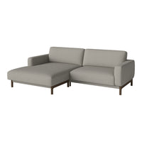 Light gray fabric sectional sofa with a modern design and dark wood legs, offering a minimalist aesthetic.