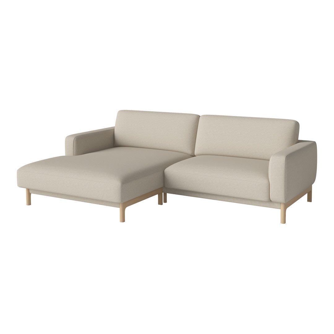 Beige sectional sofa with minimalist design and natural wood legs, featuring solid color upholstery and no visible patterns.