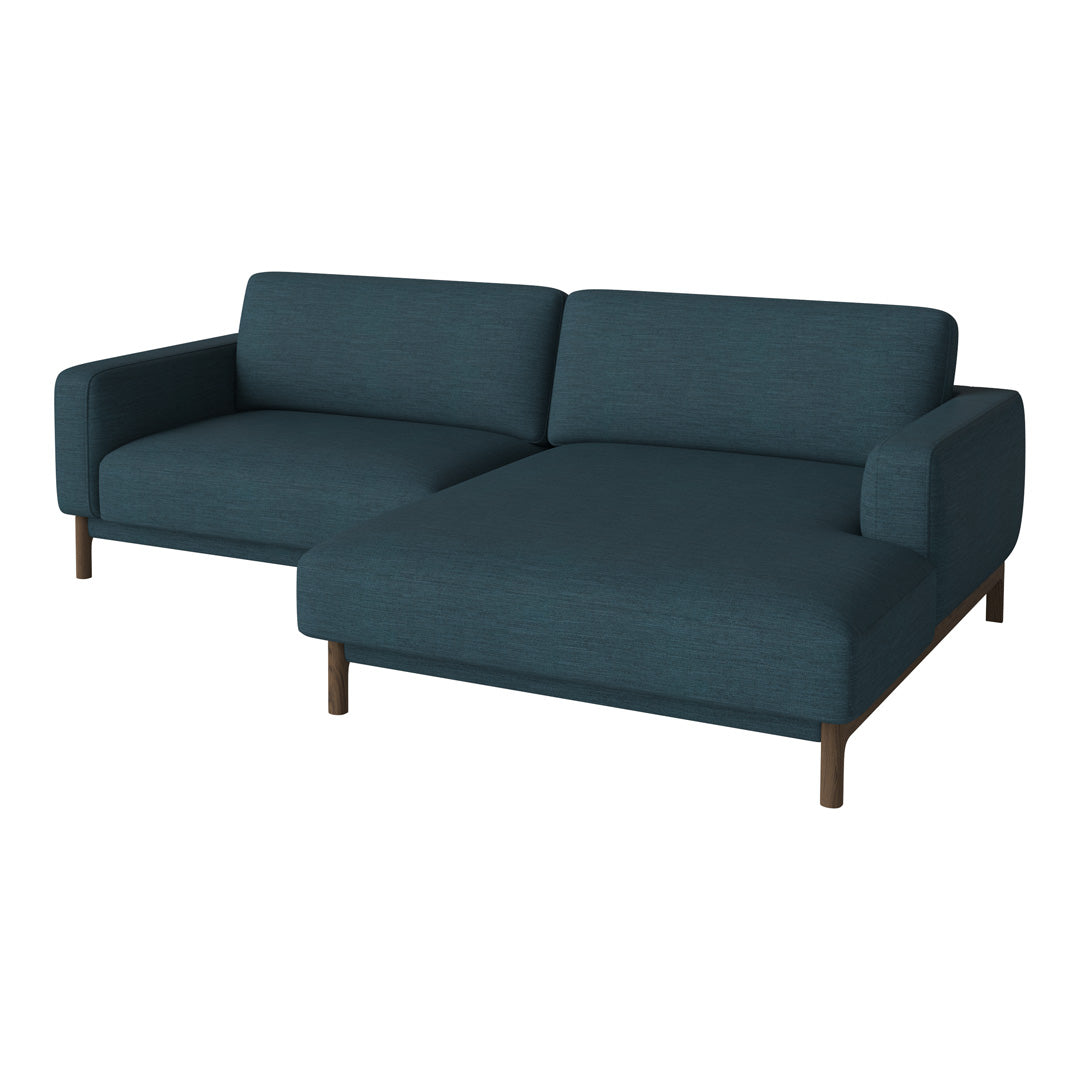 Teal fabric sectional sofa with a sleek, minimalistic design and wooden legs. Perfect for modern living spaces.