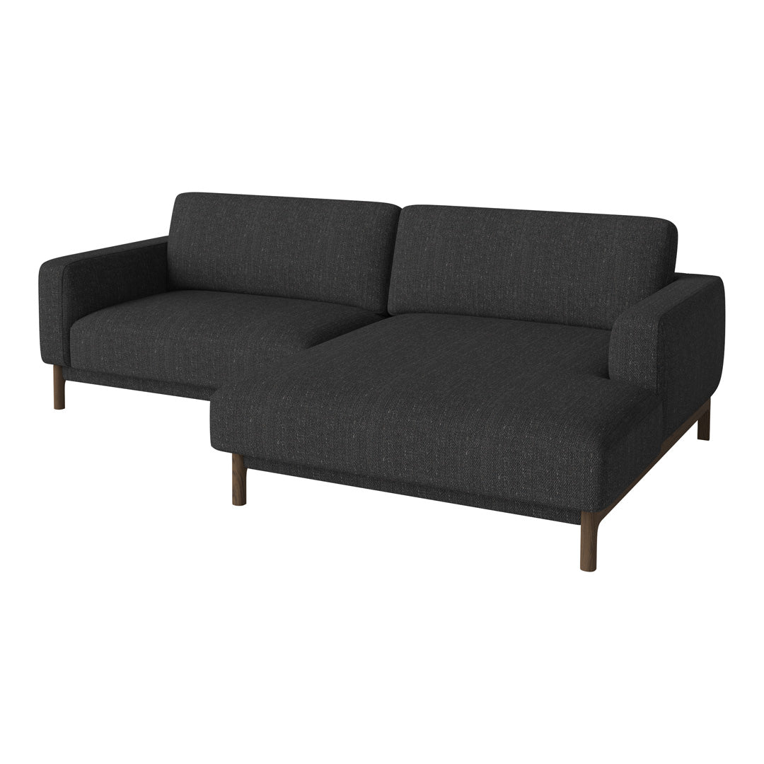 Dark gray upholstered sofa with a sleek, modern design and subtle texture, featuring brown wooden legs.
