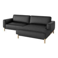 Black fabric sectional sofa with clean lines and warm wooden legs, creating a modern and minimalist aesthetic.