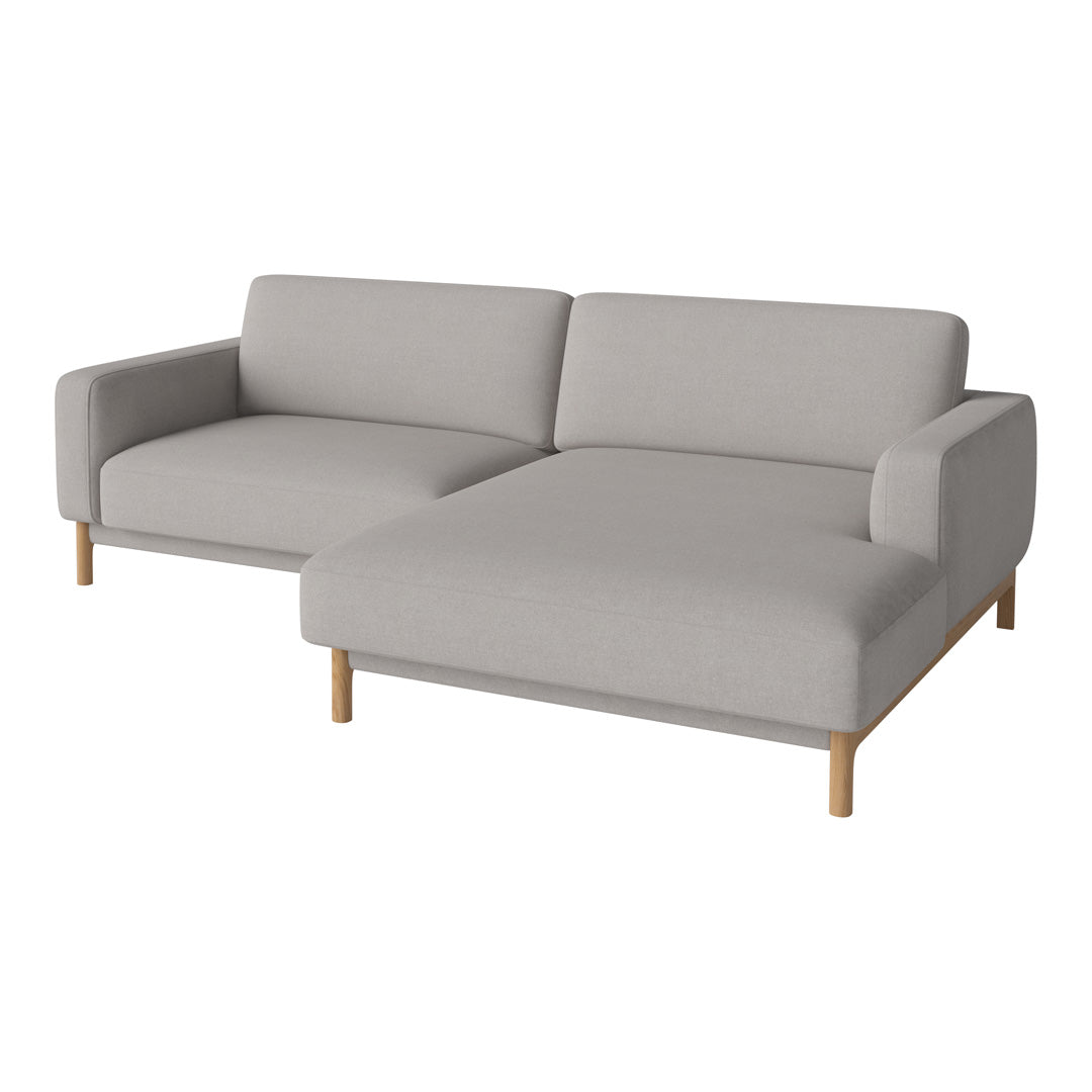 Light grey sectional sofa with a minimalist design and wooden legs, adding modern elegance to any living space.