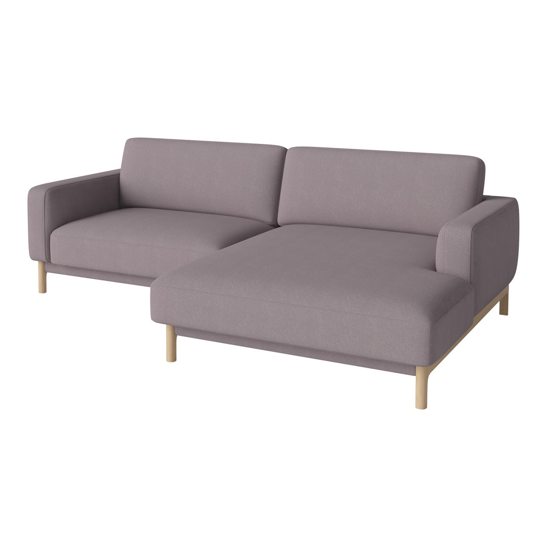 "Light gray fabric sofa with minimalist design, featuring smooth surfaces and natural wood legs."